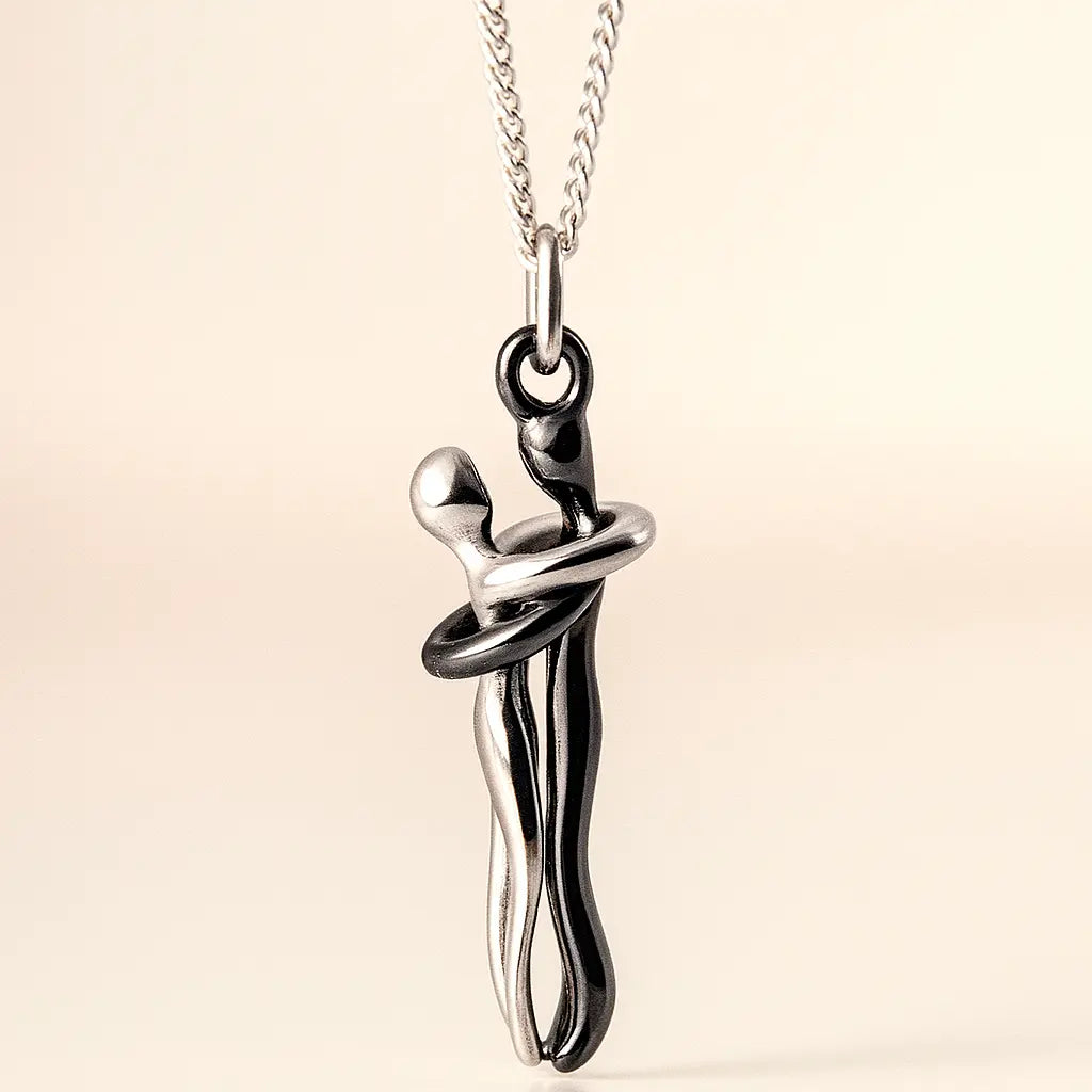 Silver necklace with a unique pendant on a beige background