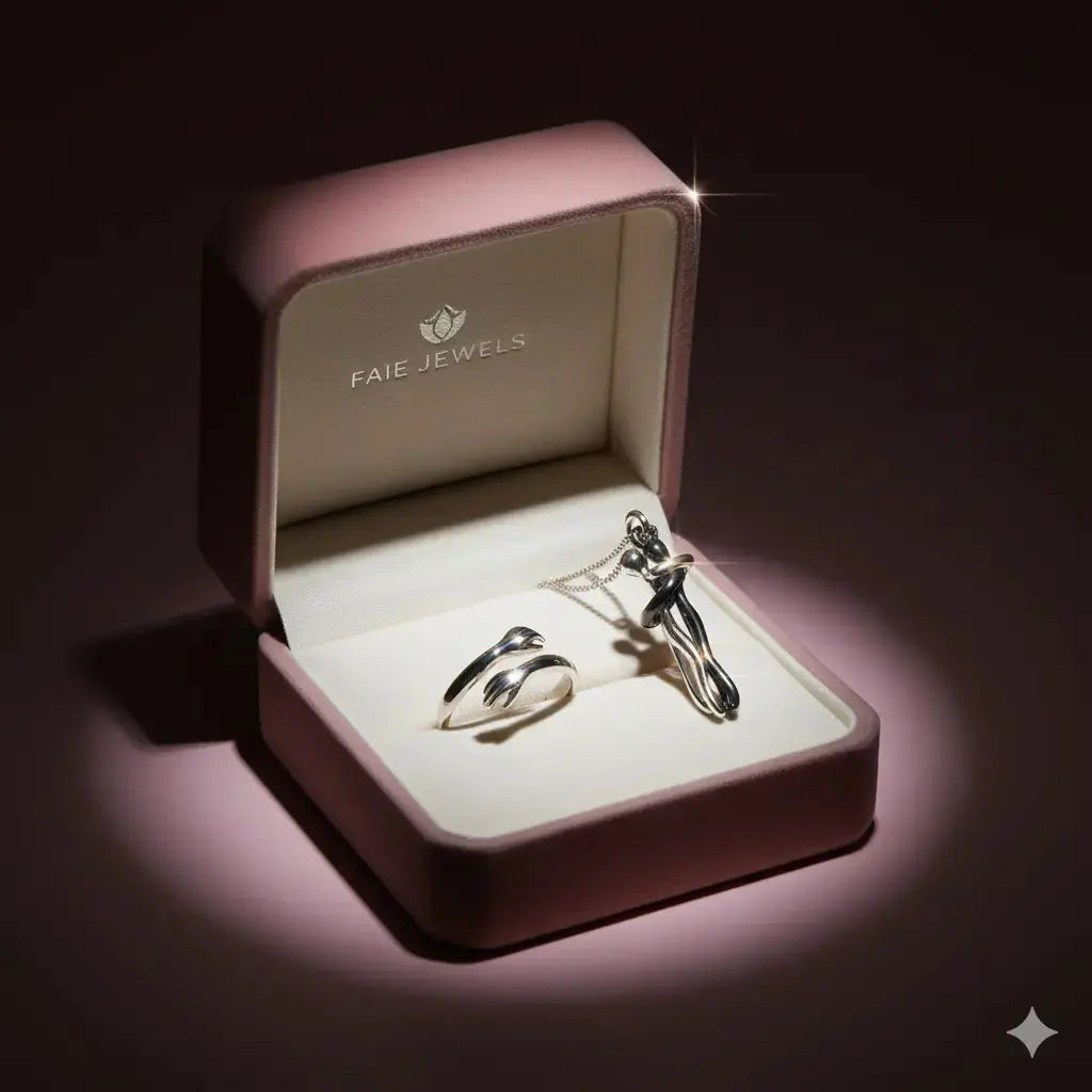 Jewelry set in a pink 'Faie Jewels' box on a dark background